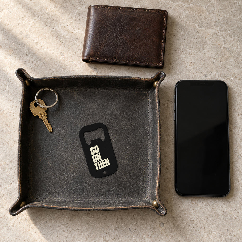 GO ON THEN bottle opener in a key tray, showing the exact printed front