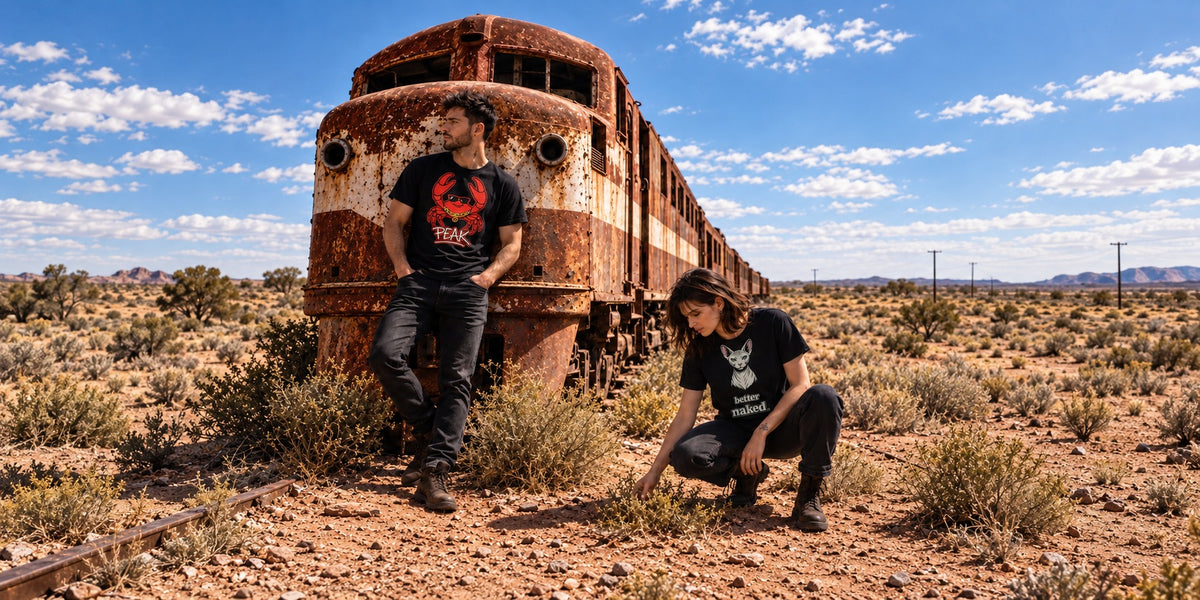 Creature collection wide hero 1: MM2 wearing PEAK and FM2 wearing Better Naked beside the desert locomotive.