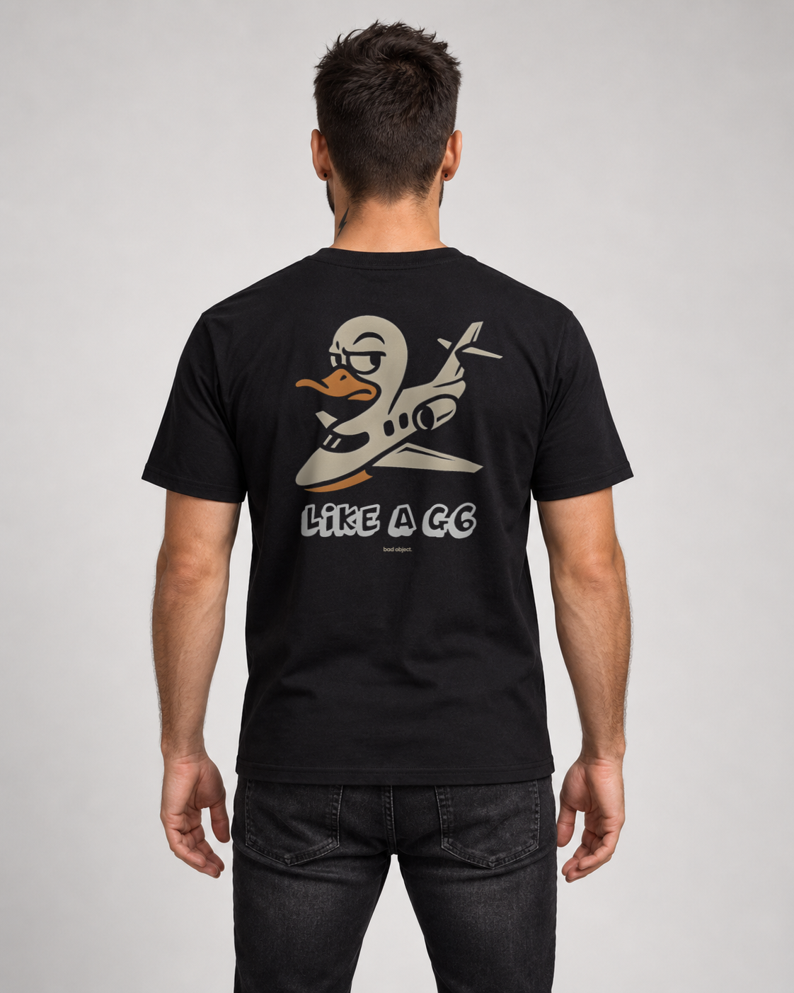 Like A G6 black Classic T-shirt on a male model, back artwork with bad object. signature