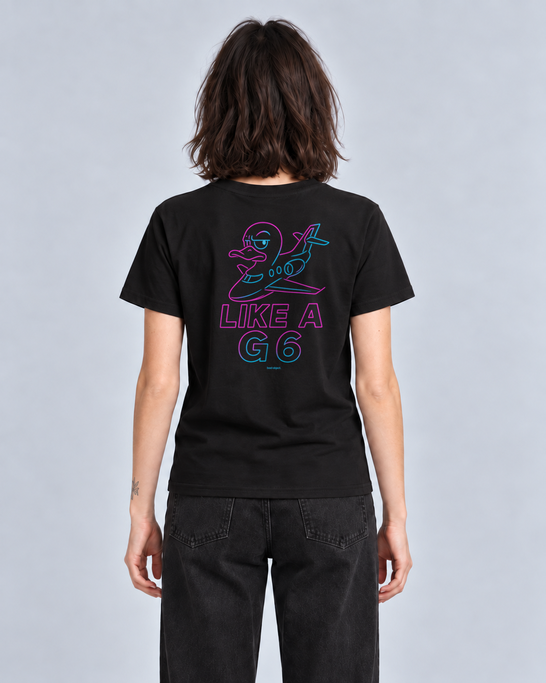 Like A G6 Neon black Classic T-shirt on a female model, back artwork with bad object. signature